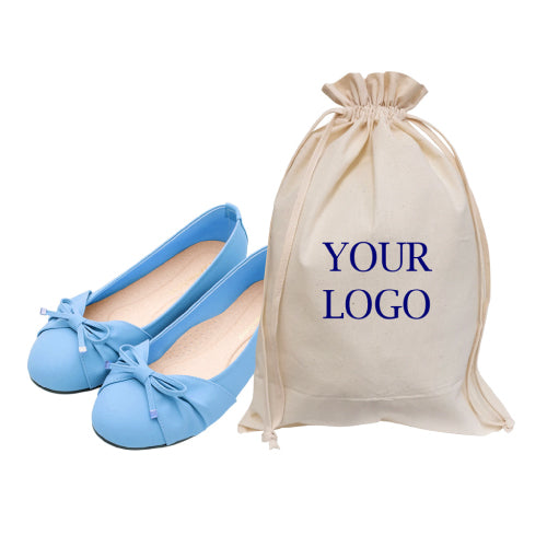 A customized cotton canvas bag with drawstring closure and blue shoes beside it