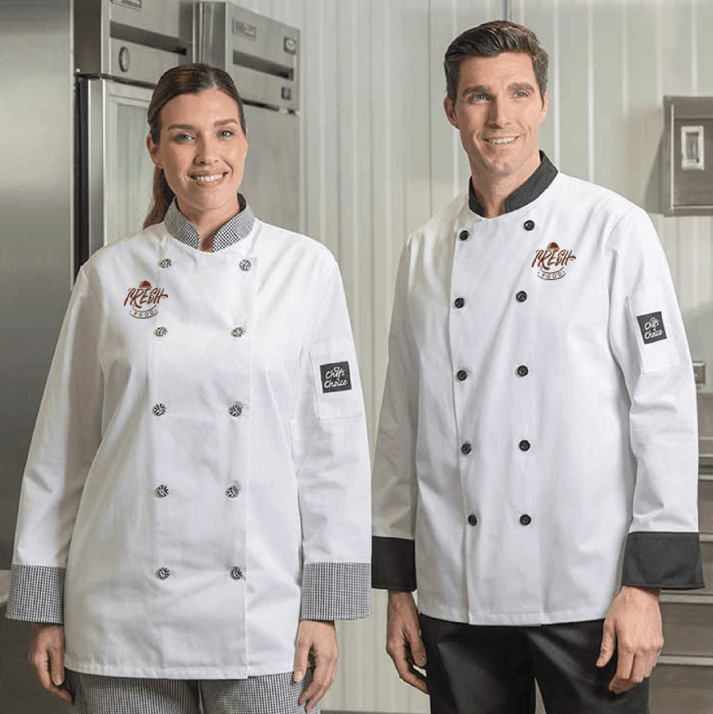 White chef coat with contrast trim, featuring black and checkered details and embroidered logo on the chest and sleeve