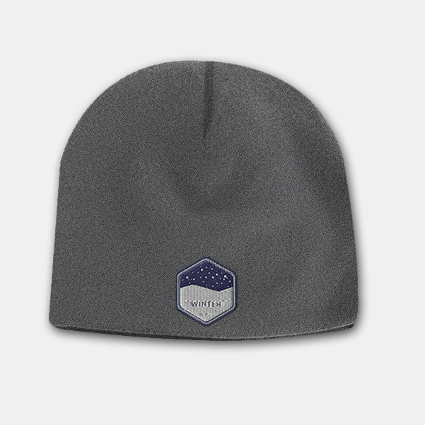 Charcoal deluxe fleece beanie with embroidered winter badge logo on the front