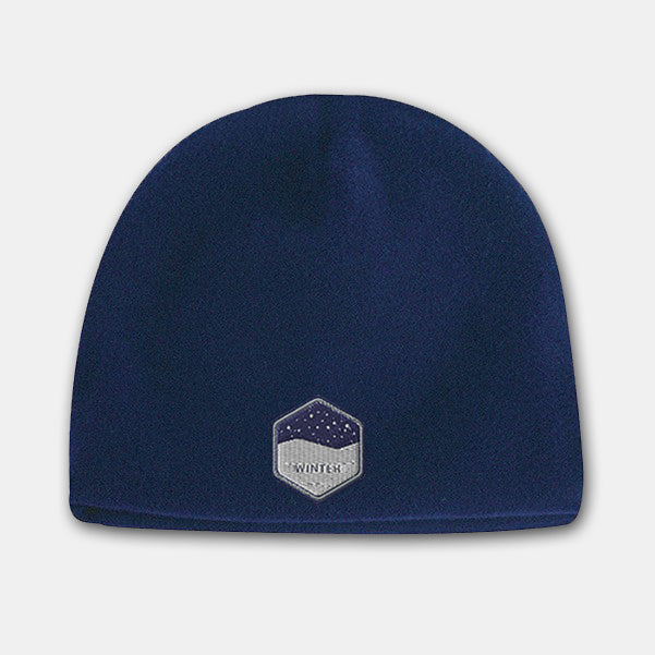 Navy deluxe fleece beanie with embroidered winter badge logo on the front