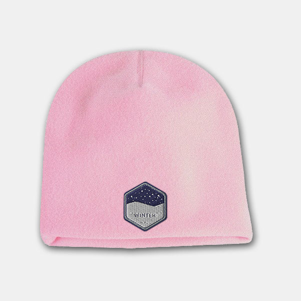 Pink deluxe fleece beanie with embroidered winter badge logo on the front