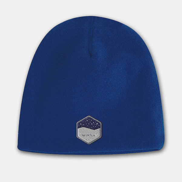 Royal blue deluxe fleece beanie with embroidered winter badge logo on the front
