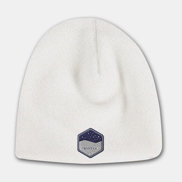 White deluxe fleece beanie with embroidered winter badge logo on the front