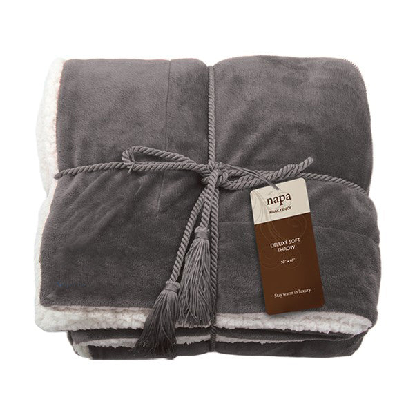 Grey deluxe lambswool throw blanket with white fleece lining, tied with matching cord and branded tag
