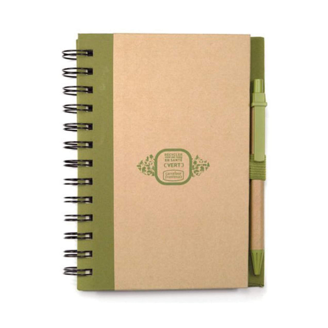 Eco-friendly spiral bound notebook with kraft cover, green binding, and matching green harvest pen, featuring a green logo on the front.