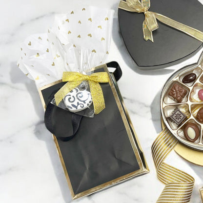 Black paper gift bag with gold edge, measuring 10 inches width, 5 inches depth, and 13 inches height, Queen West style