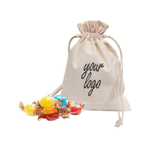 Colorful candies spilling out of a canvas drawstring bag with a logo design.