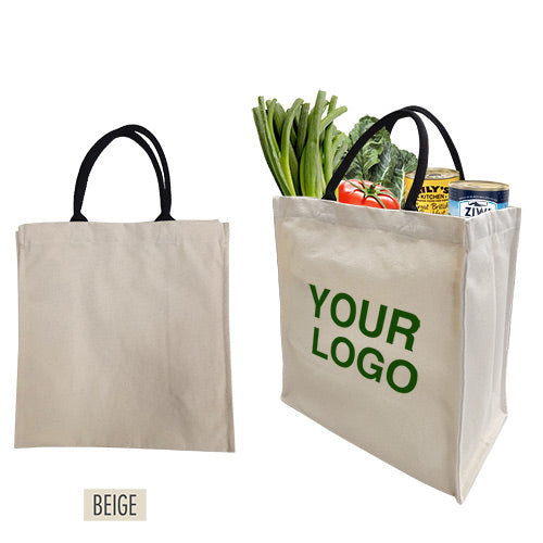 A customized beige canvas grocery bag with black handles and filled with fresh fruits.