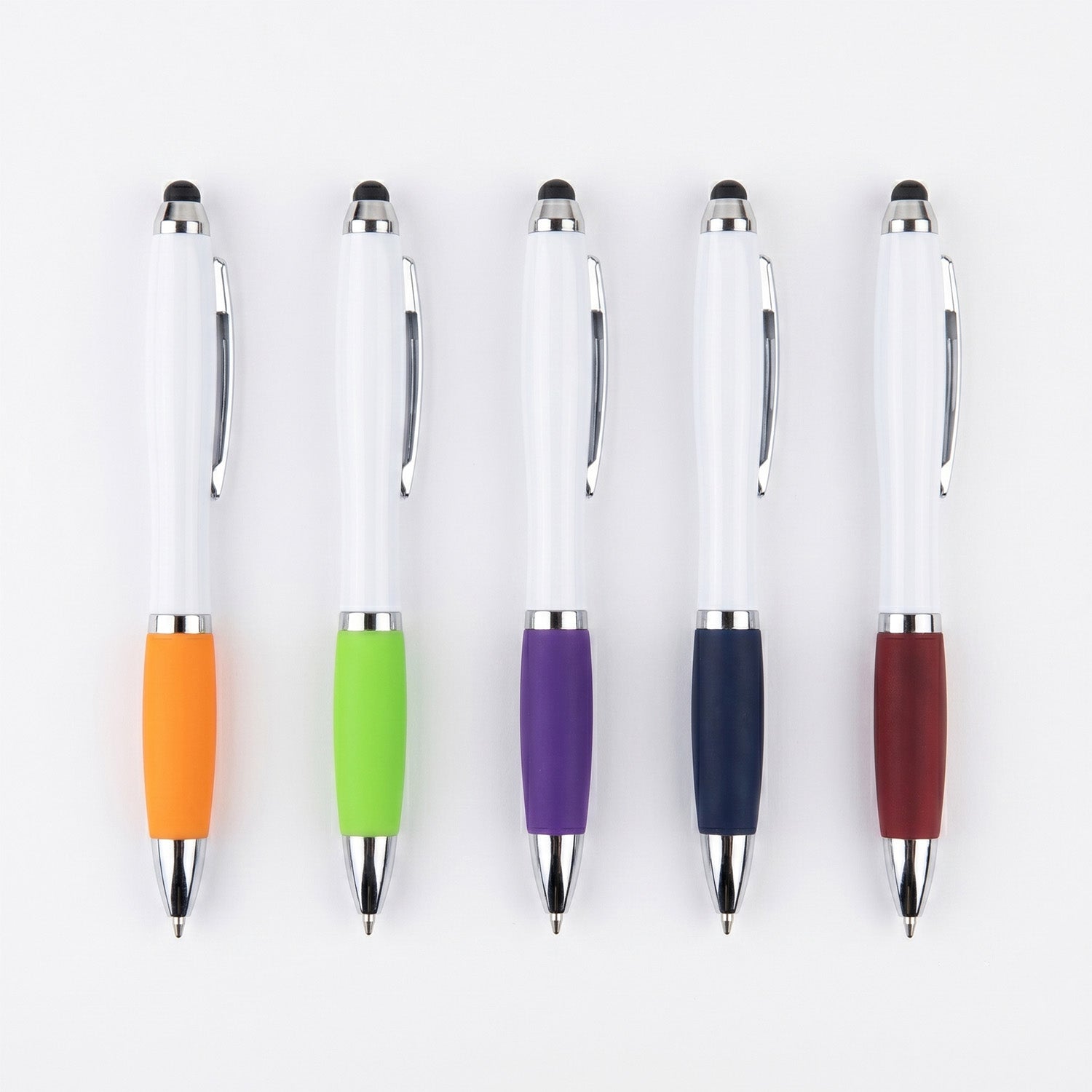 Five white ballpoint pens with black stylus tips lined up vertically against a white background. Each pen features silver metal accents and a different colored rubber grip: orange, bright green, purple, dark blue, and maroon.