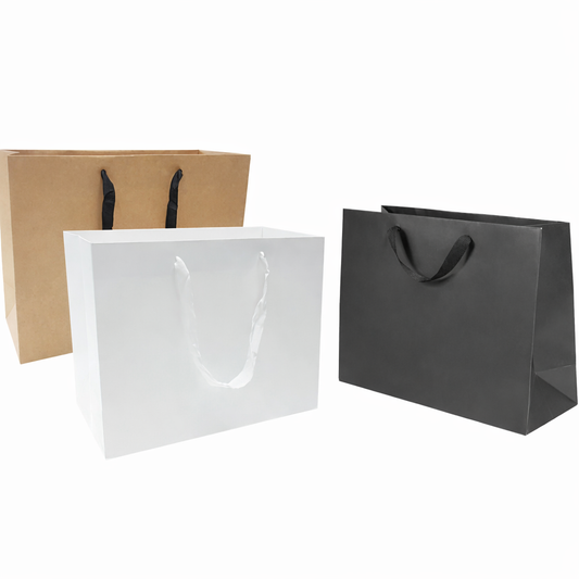 Manhattan style heavyweight paper bags, 200gsm, large size 16 inches wide by 6 inches deep by 12 inches high, shown in kraft, white, and black rope handles.