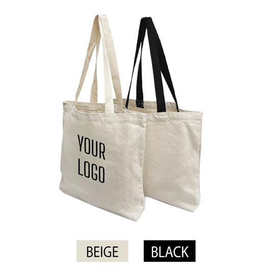 Two beige canvas tote bags in beige and black handles with the words "your logo" printed on them.
