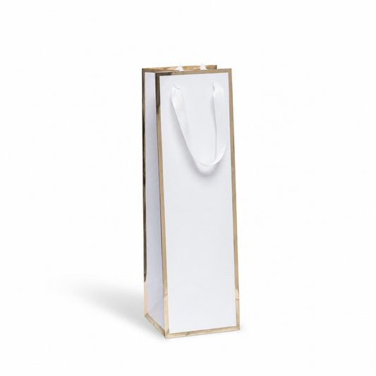 Minimalist luxury wine gift bag with metallic gold trim and white ribbon handles standing upright on a clean white studio background, featuring soft natural shadows and generous negative space for branding, logo placement, or custom packaging presentation.
