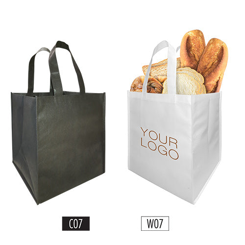 A plain black non-woven bag and a custom white grocery bag filled with breads and box size in mind.