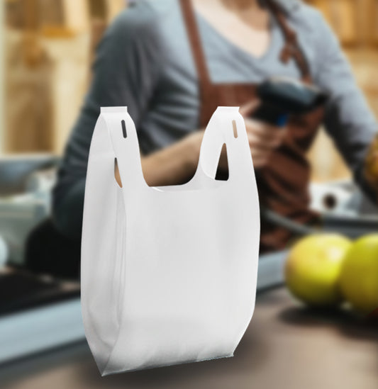 Woman holding a white t-Shirt shopping bag in cashier