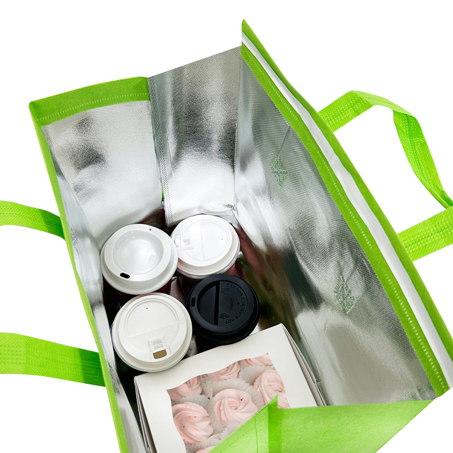 A green thermal delivery bag with coffee and other items