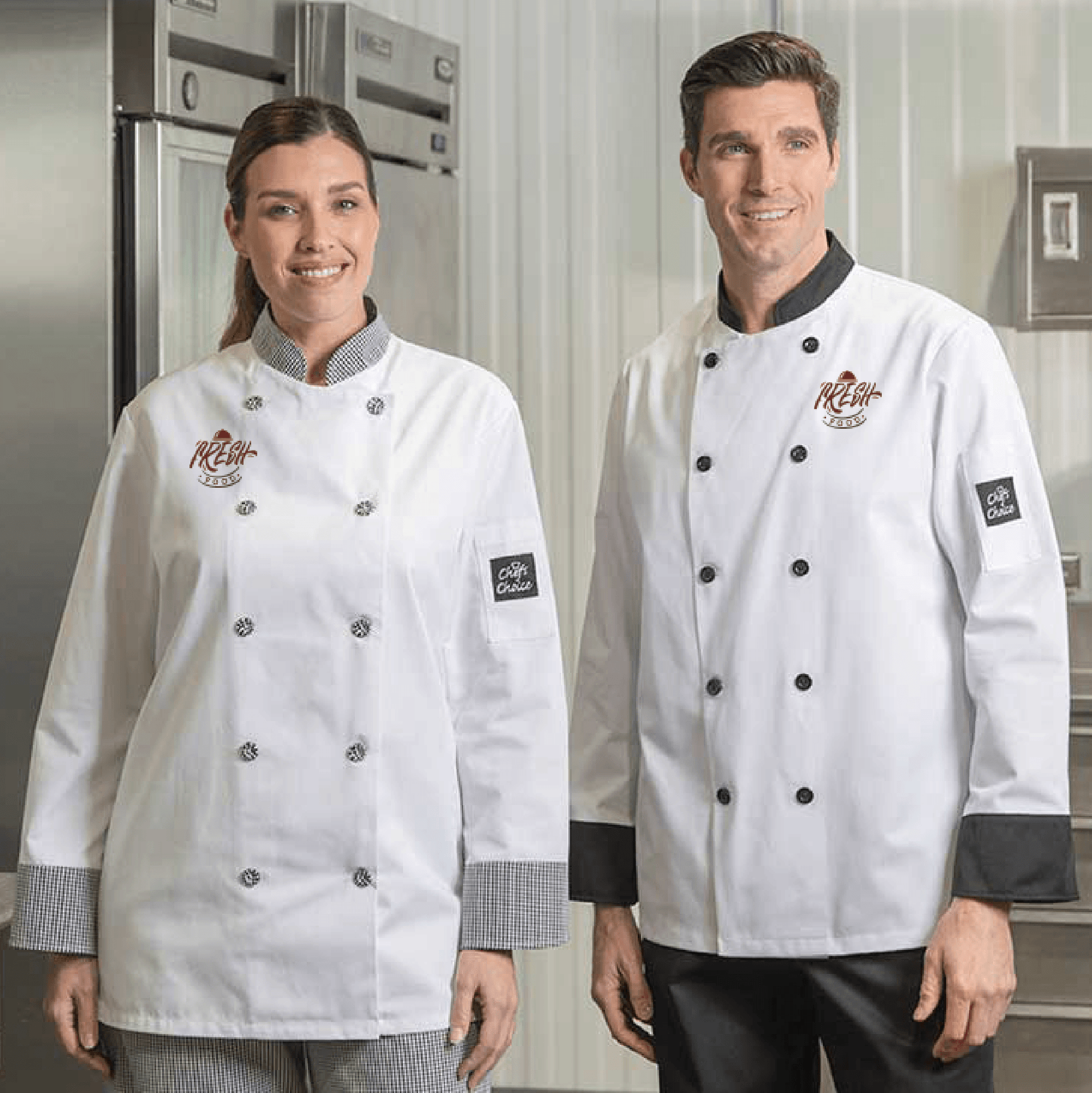 White chef coat with contrast trim, featuring black and checkered details and embroidered logo on the chest and sleeve