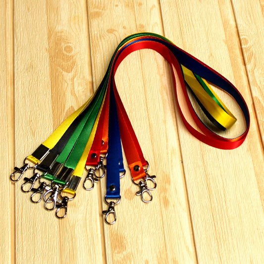 Custom nylon lanyards in multiple colors with 2 metal lobster clips, durable design for badges, keys, and ID holders, displayed on wooden background