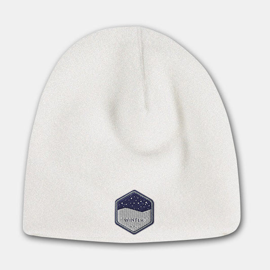 White deluxe fleece beanie with embroidered winter badge logo on the front