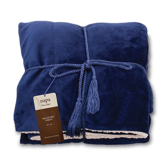 Deluxe navy blue lambswool throw blanket neatly folded with rope tie and embroidered logo tag