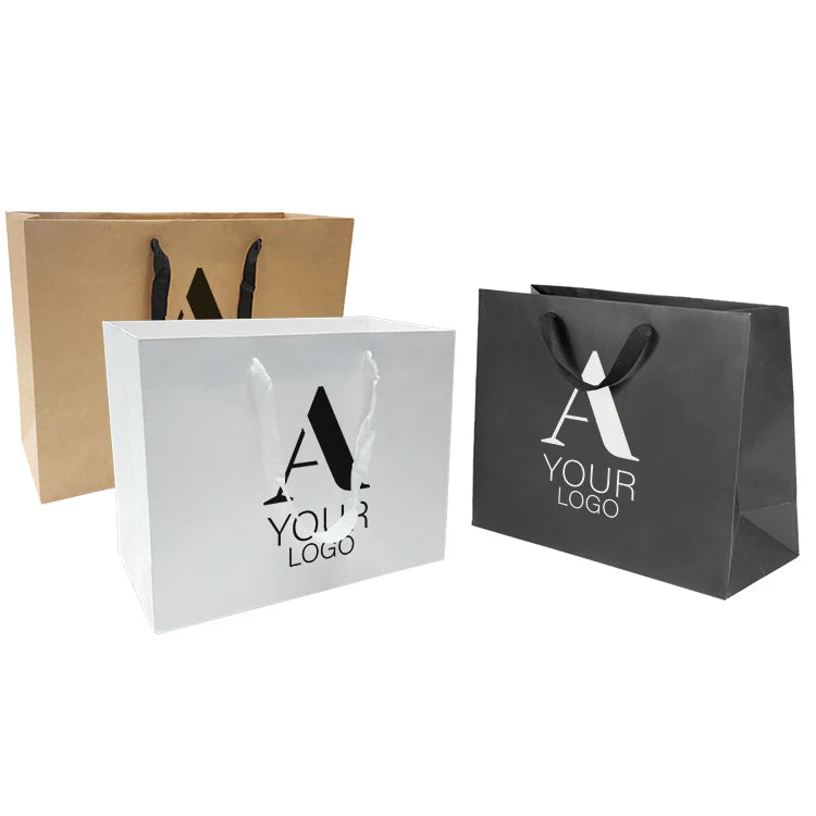 Manhattan style heavyweight paper bags, 200gsm, large size 16 inches wide by 6 inches deep by 12 inches high, shown in kraft, white, and black with custom logo and rope handles.