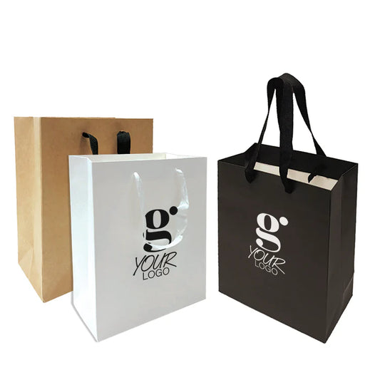 Small Manhattan style paper bags 200gsm heavy weight in kraft, white, and black with custom logo print and sturdy handles, 8 inches wide, 4 inches deep, 10 inches high