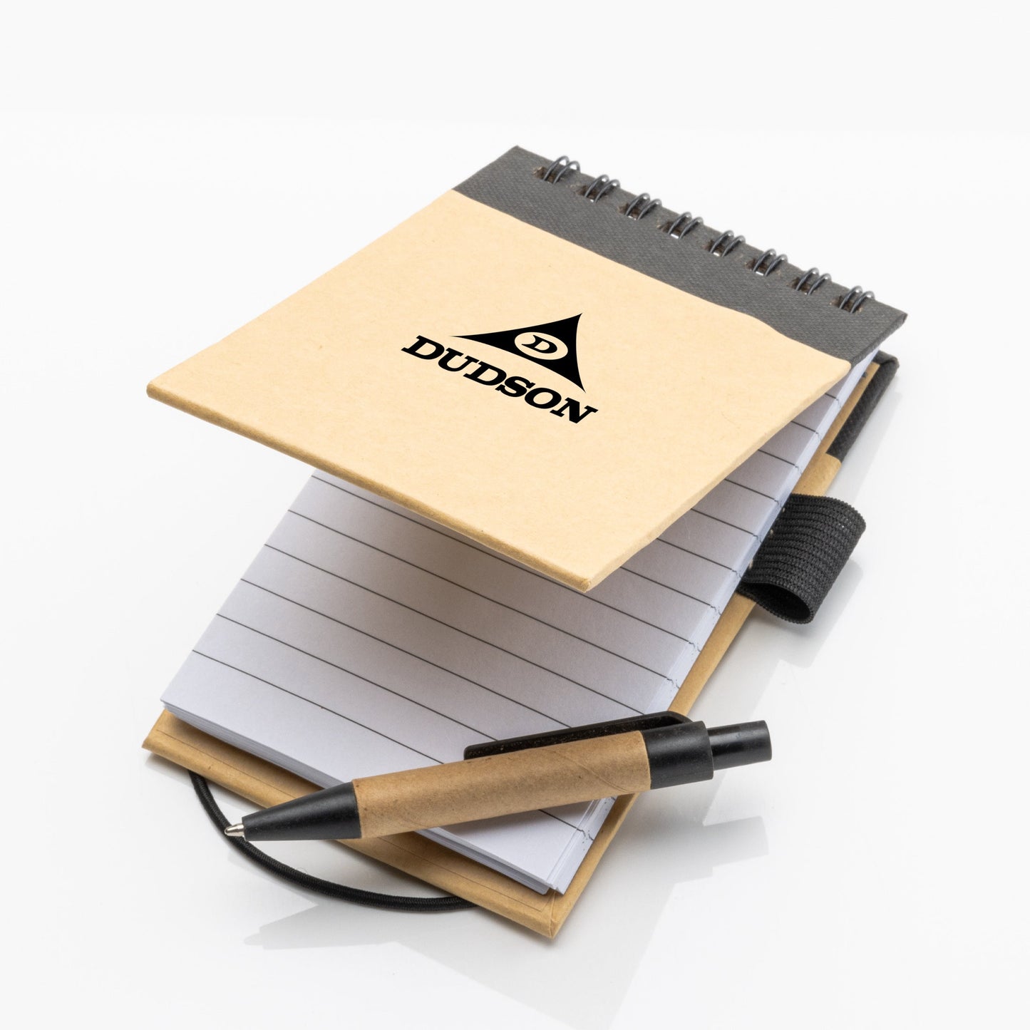 Open recycled flip-up notepad with lined pages, elastic closure, and eco-friendly pen, featuring Dudson logo on the cover.
