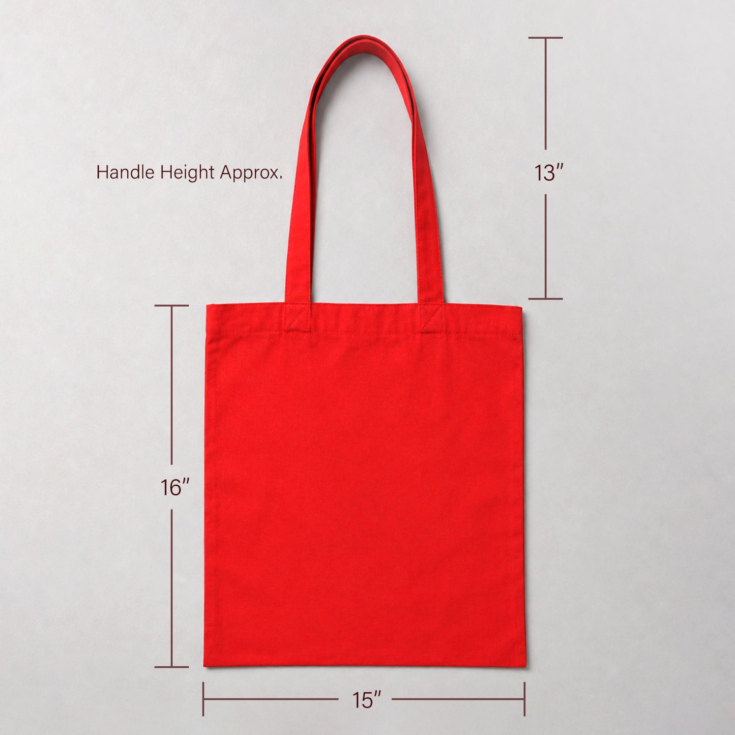 A bright red canvas tote bag shown on a light gray background with dimension lines and text indicating handle height approximately 13 inches, bag height 16 inches, and width 15 inches.