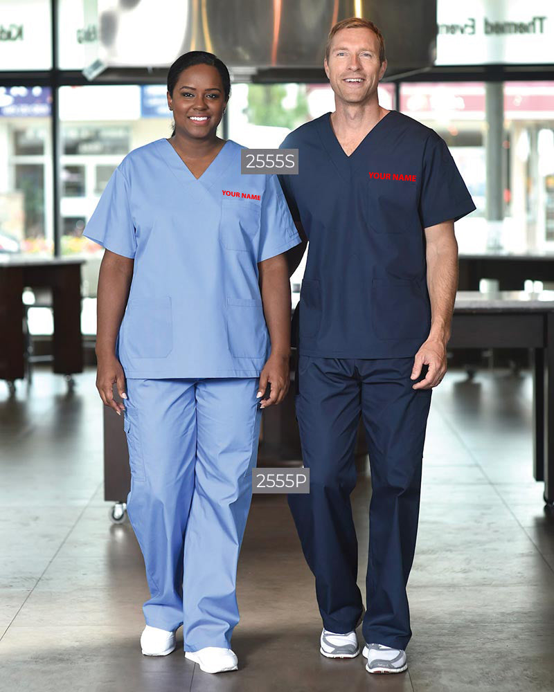 Unisex V-neck scrub sets with embroidered logo in light blue and navy, worn by healthcare professionals in a hospital setting