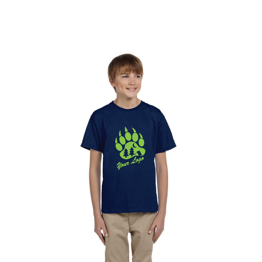 Gildan Ultra Cotton® T-shirt G200B for youth in navy blue, featuring a green bear paw print design with trees and “Your Logo” text on the front, worn by a boy in beige pants.